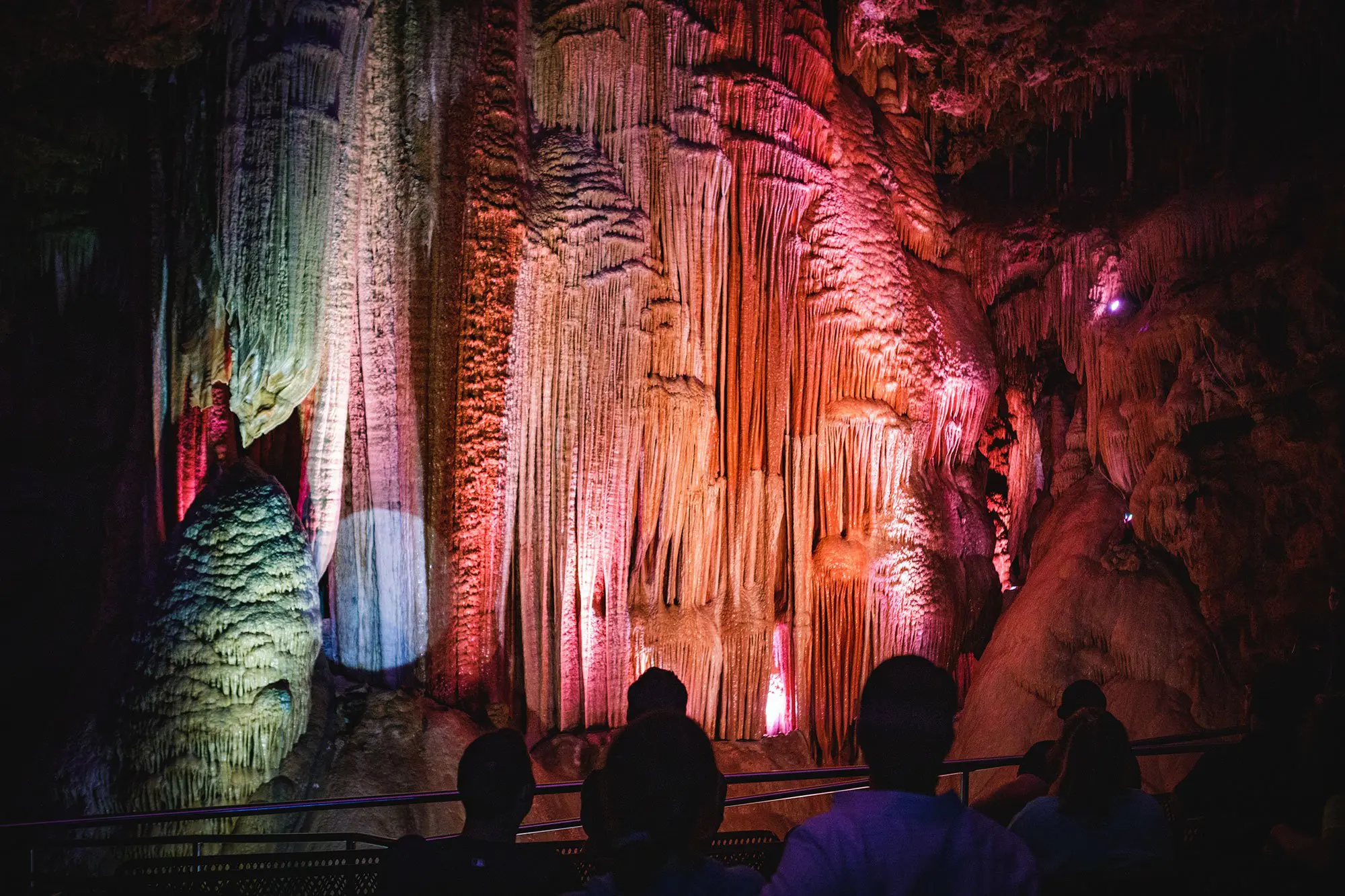 Group of visitors enjoying the light show inside of Meramec Caverns