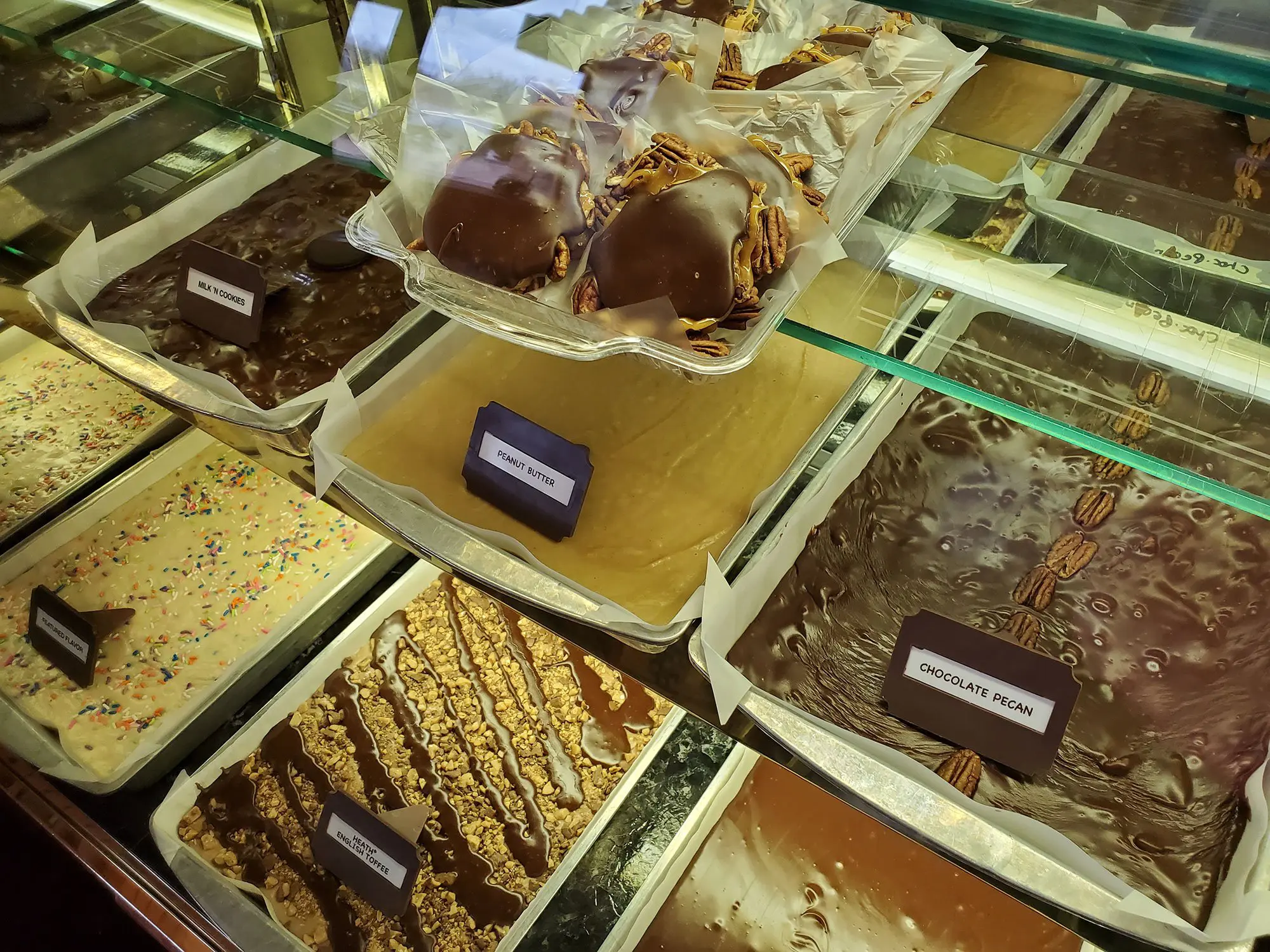 Chocolate covered turtles dessert along with various types of fudge for sale at Meramec Caverns