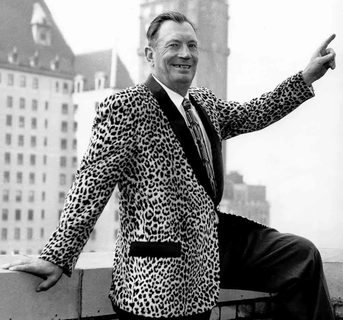 Black and white photo of Lester Dill in a leopard print jacket
