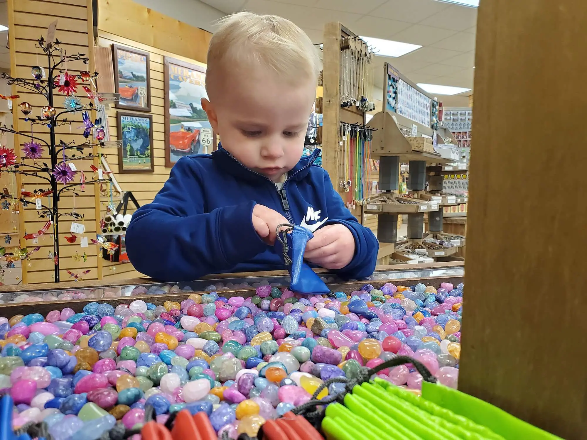 Young boy playing with rocks at the Meramec Caverns gift shop